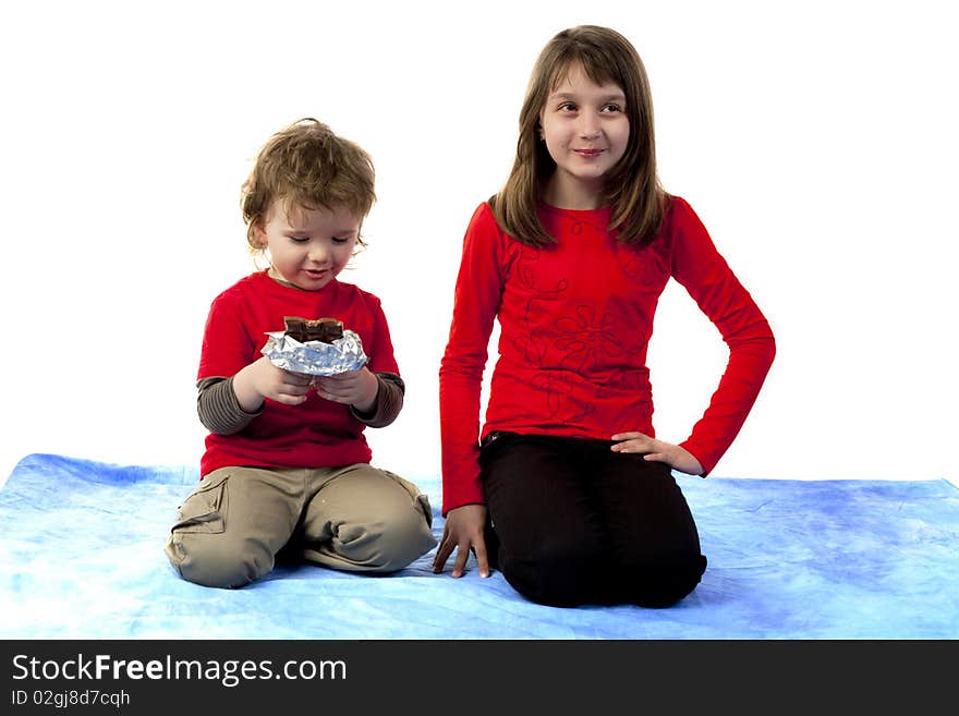 Cute boy and girl sitting