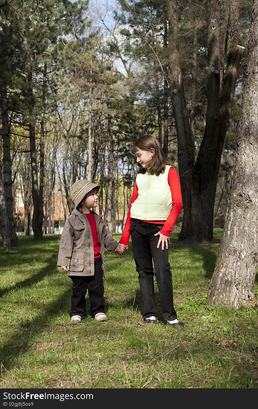 Little boy and a girl looking at each other