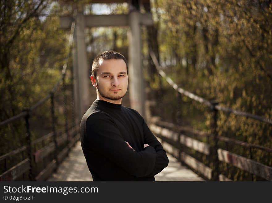 Cute adult posing at camera in a forest. Cute adult posing at camera in a forest