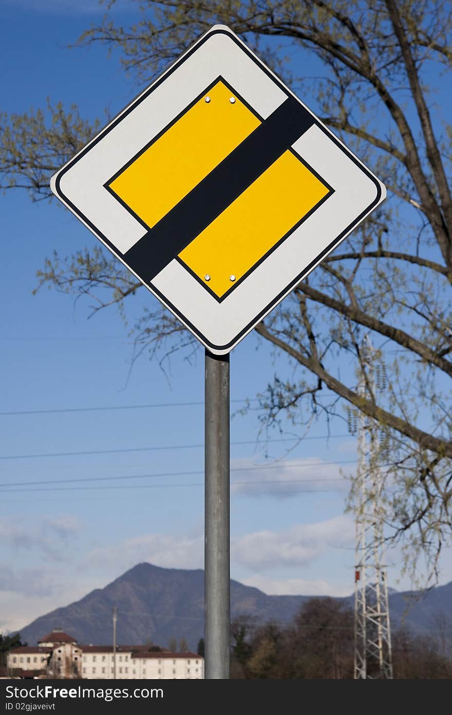 Road sign on mountain and tree background