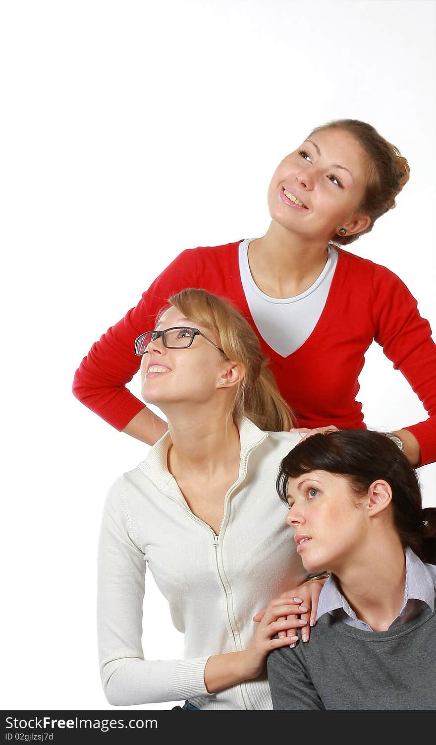 Three girls-girl-friends look upwards