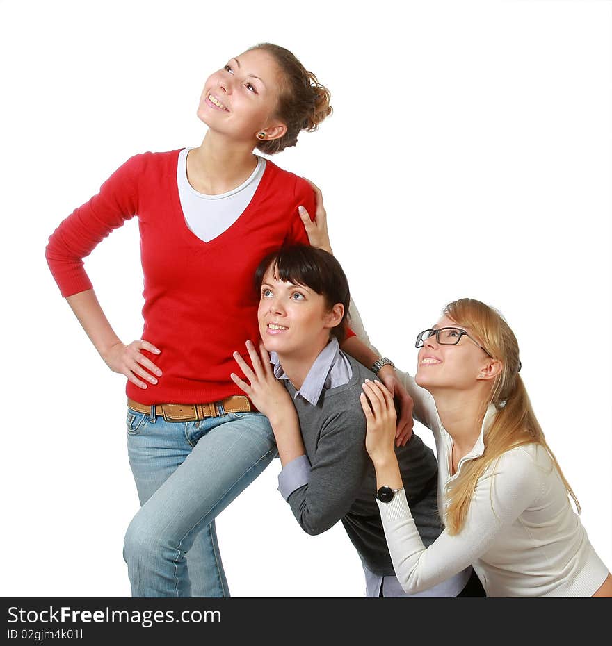 Three girls-girl-friends look upwards