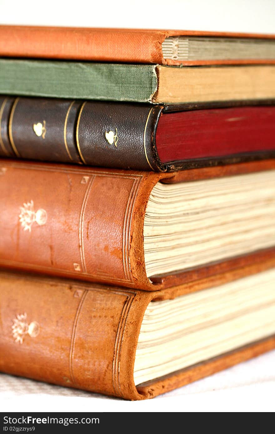 Five old books on the white background