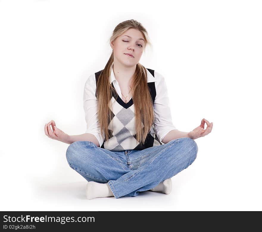 Pretty relaxed woman practicing yoga on a white background