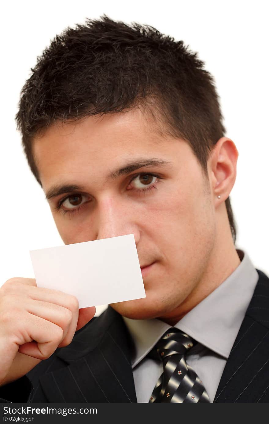 A young businessman in his dark suit holds a business-card in a hand. A young businessman in his dark suit holds a business-card in a hand