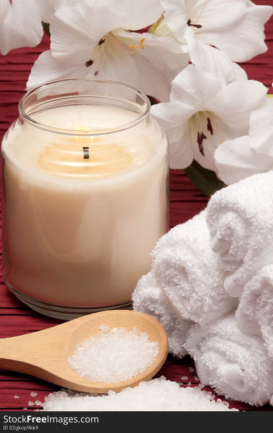 Candle, sea salt, flower and towels. Candle, sea salt, flower and towels