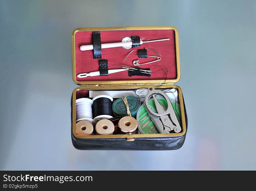 Tailoring tools laying on a glass table