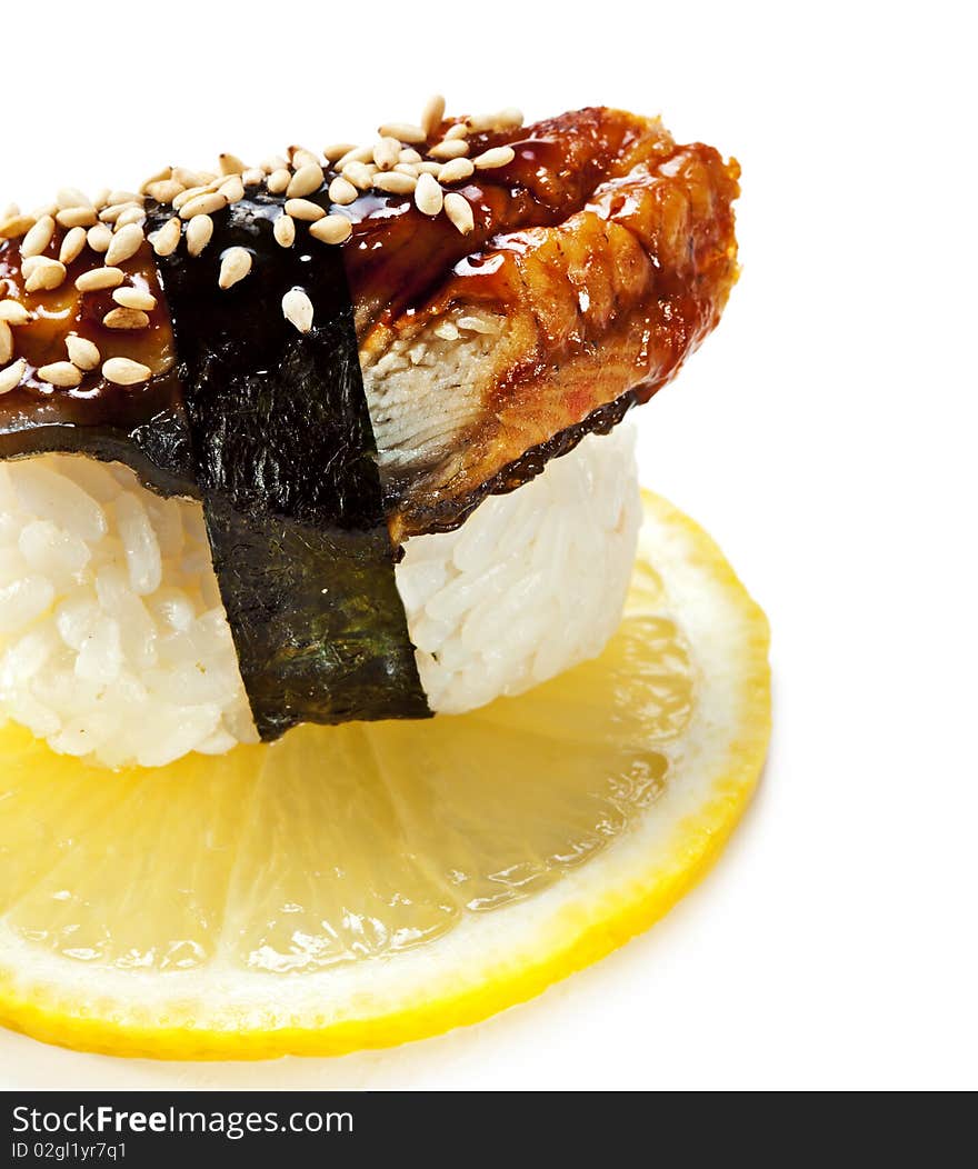 Japanese Cuisine - Eel (unagi) Nigiri Sushi. Topped with Eel Sauce and Sesame. Served on Lemon Slice. Japanese Cuisine - Eel (unagi) Nigiri Sushi. Topped with Eel Sauce and Sesame. Served on Lemon Slice