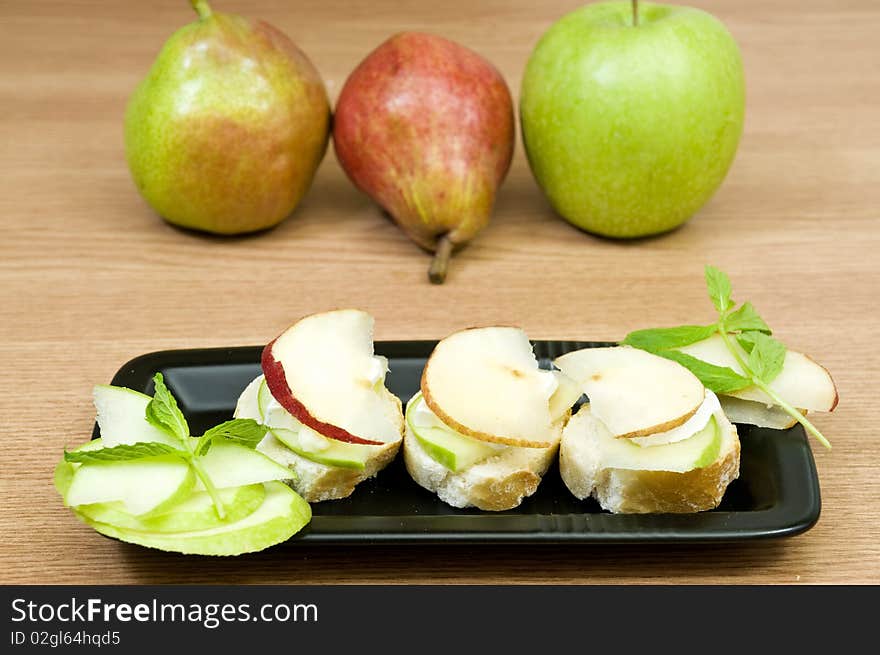 Delicious canapes with french cheese and fruits