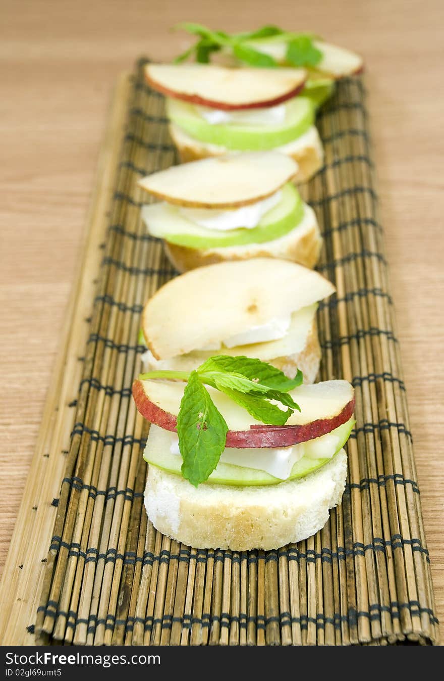 Delicious and fresh appetizer row, white cheese and apple. Delicious and fresh appetizer row, white cheese and apple