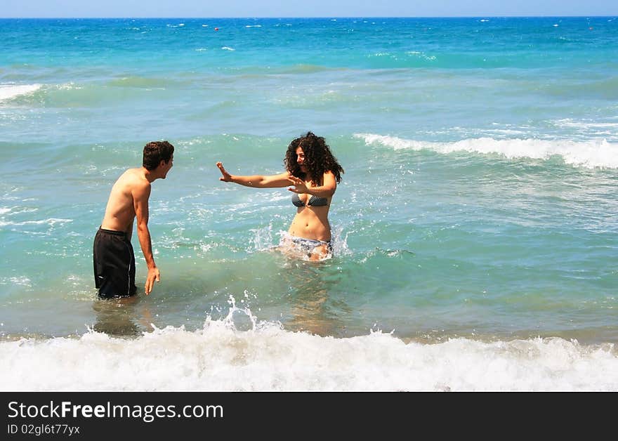 Couple having fun in the sea.