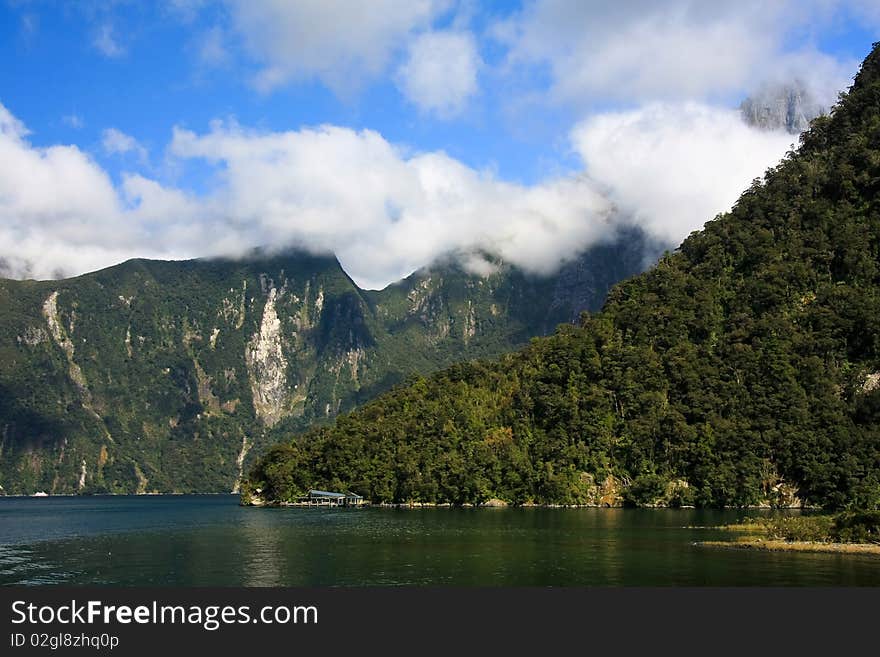 Broken clouds over Milford Sound, New Zealand South Island. Broken clouds over Milford Sound, New Zealand South Island.