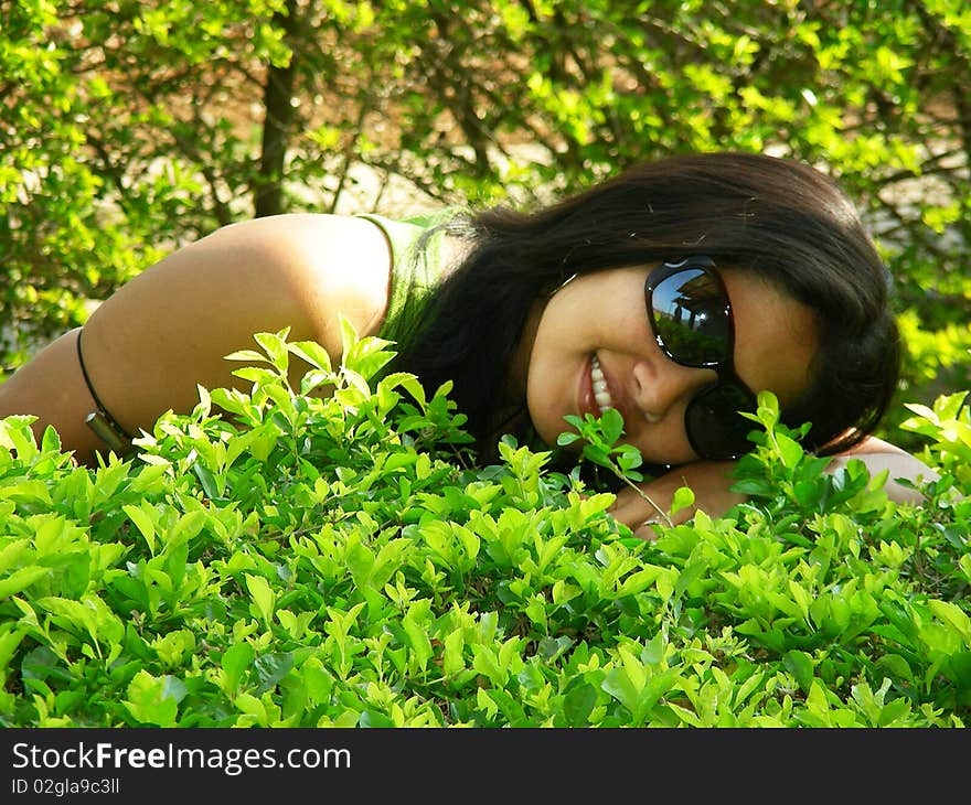 A youngster happily lying on the meadow. A youngster happily lying on the meadow.