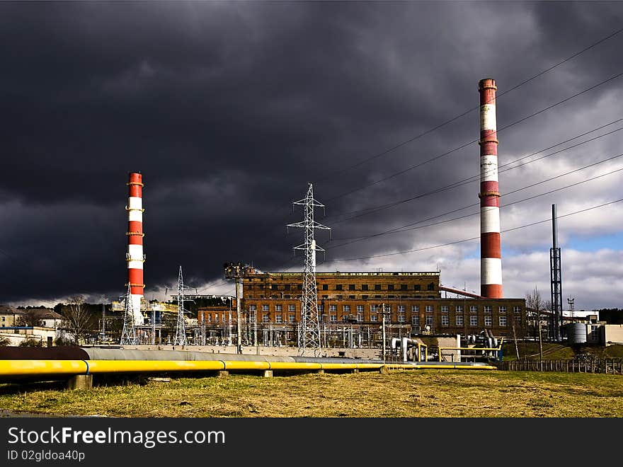 Smokestack, line factory and dark clouds