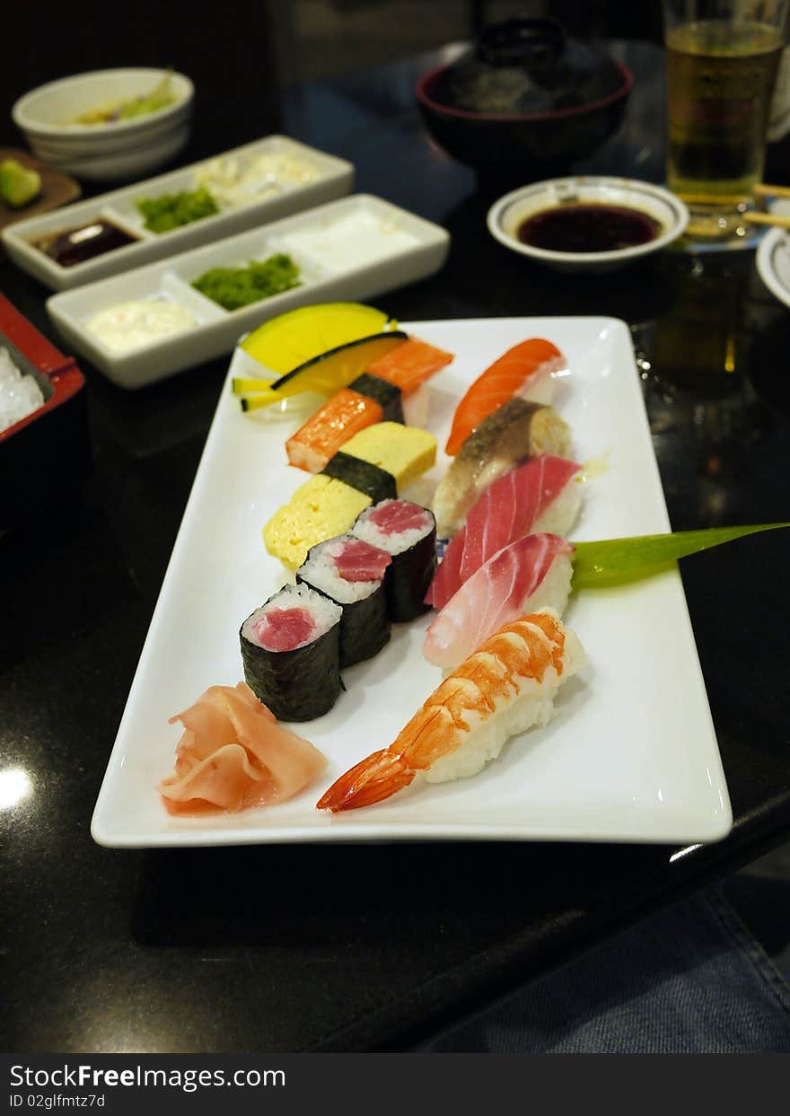 Japanese Food, Sashimi and maki plate with shrimp, salmon, red tuna on rice