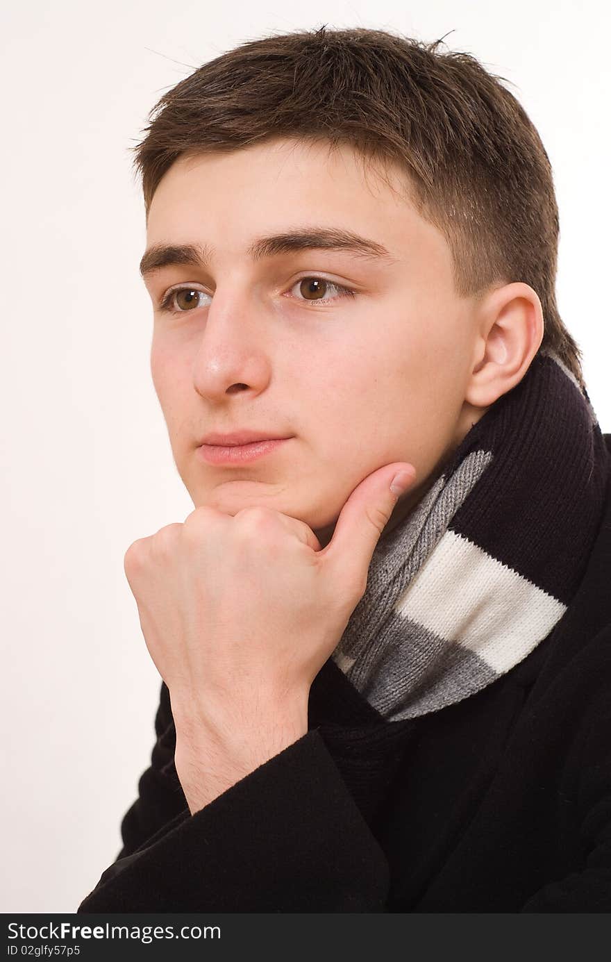 Handsome boy standing on a white background