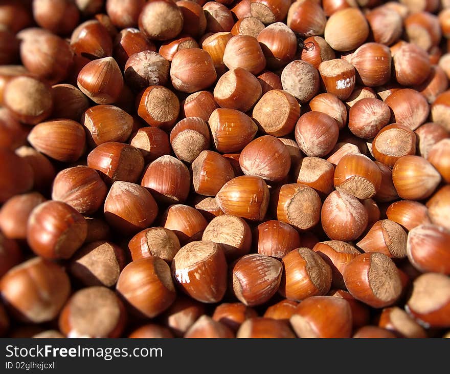 A closeup of unpeeled hazelnuts on a french market