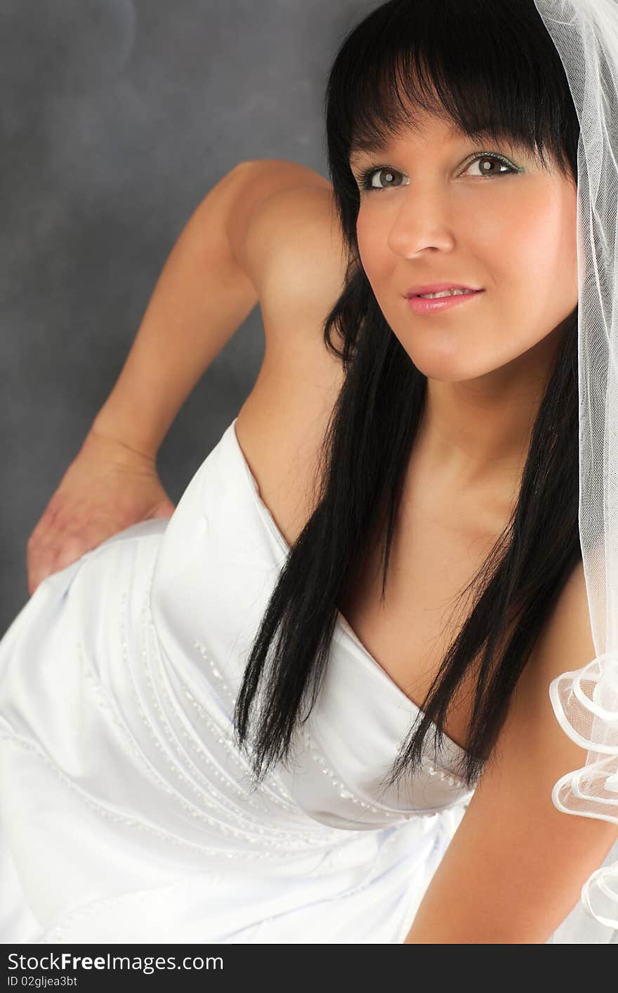 Portrait of a bride in white wedding dress. Portrait of a bride in white wedding dress