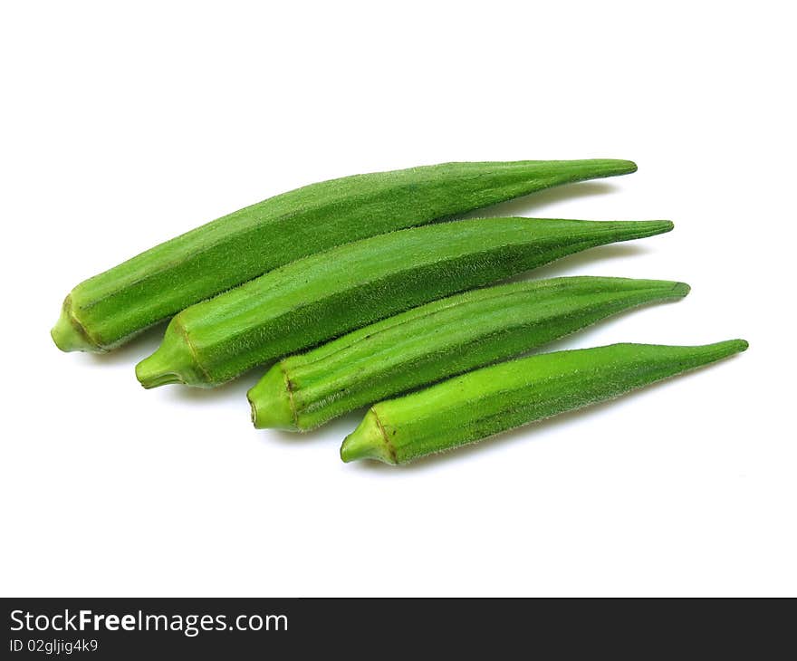 Close up four fresh okras(ladyfinger/bhindi) isolated on white. Close up four fresh okras(ladyfinger/bhindi) isolated on white.