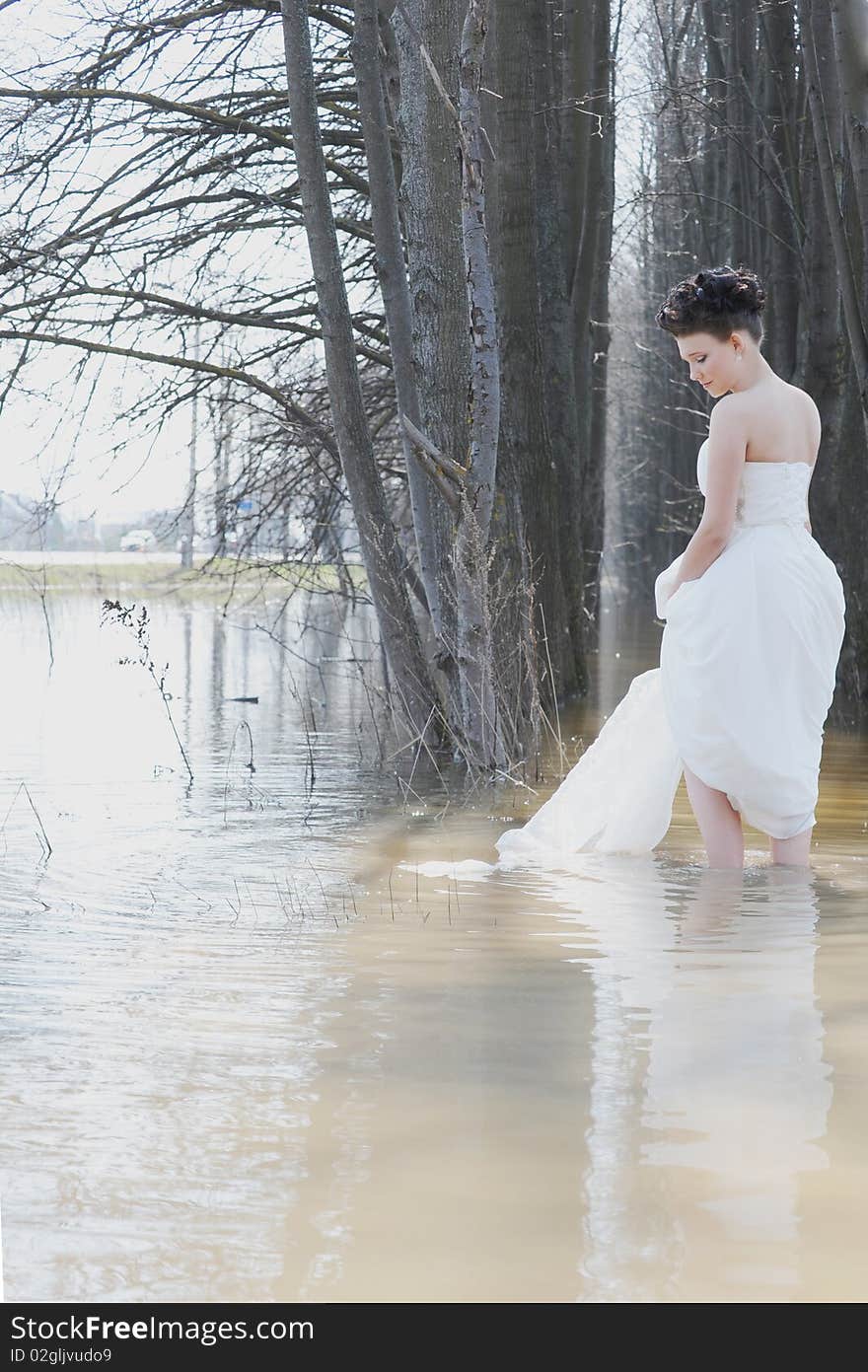 Bride standing in the water
