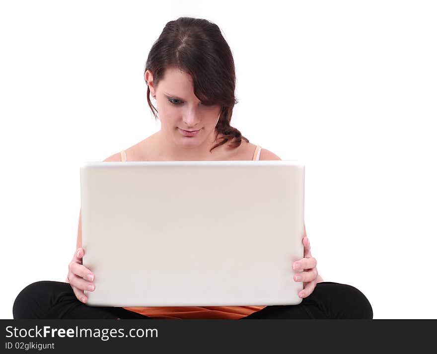 Portrait of teenage girl sitting and holding laptop. Portrait of teenage girl sitting and holding laptop