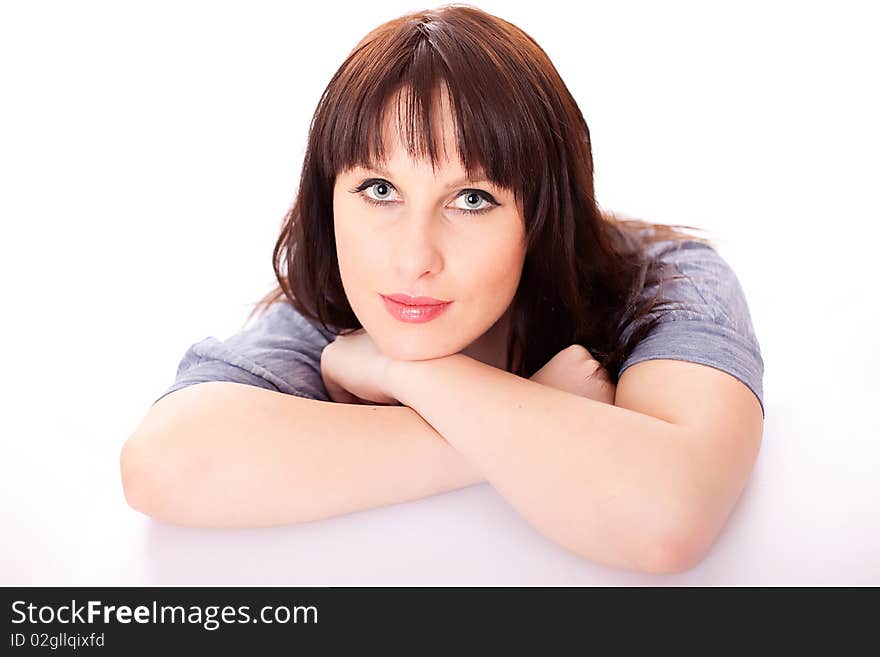 Beautiful Smiling Brunette Resting on her Elbows