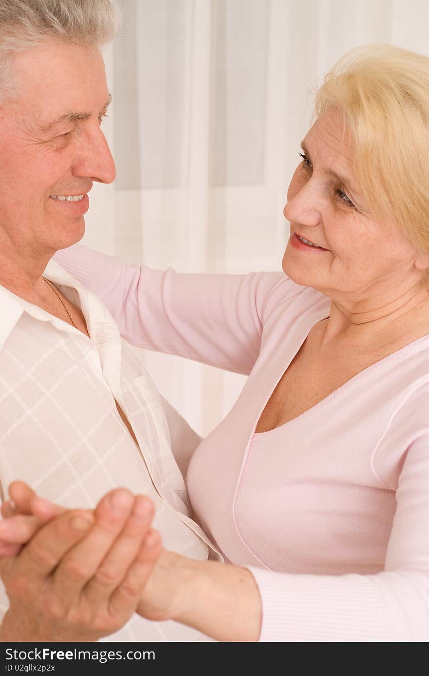 Nice  couple dancing on a white background. Nice  couple dancing on a white background