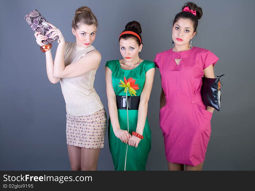 Three happy retro-styled girls studio shot