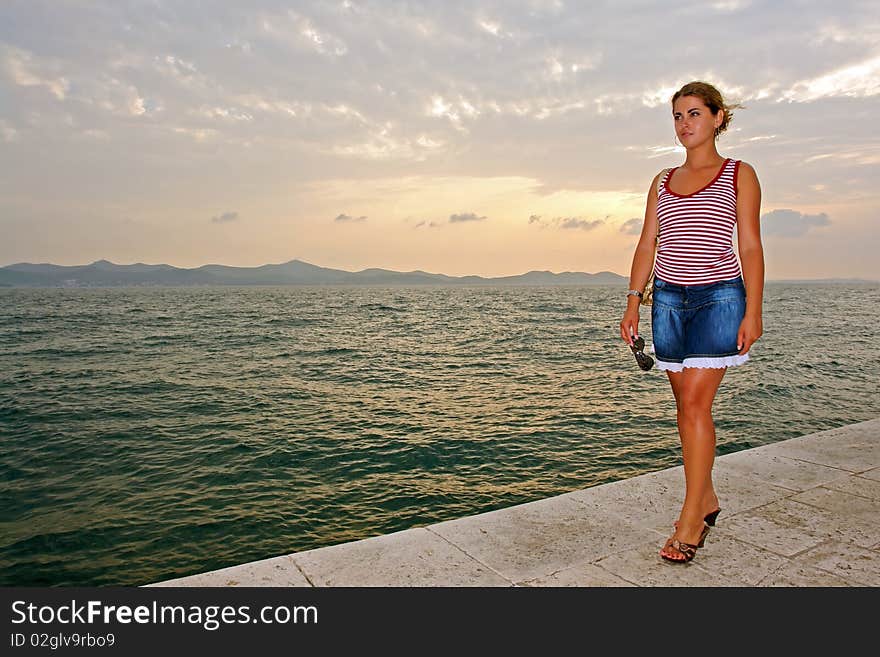 Beautiful model posing at the sea