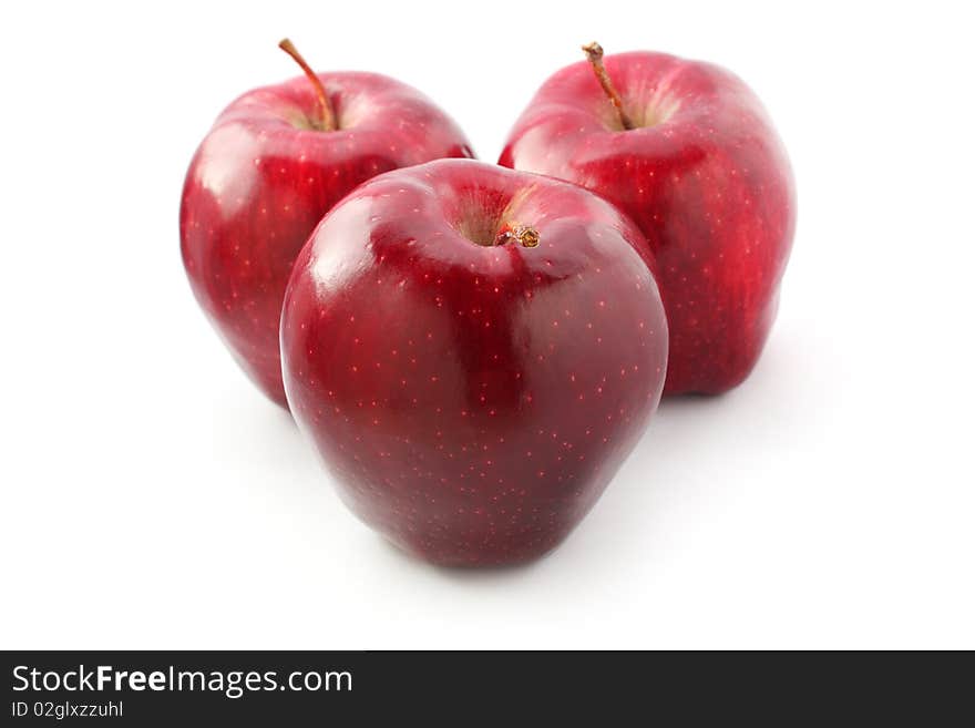 Three perfect red apples isolated on white background. Three perfect red apples isolated on white background.