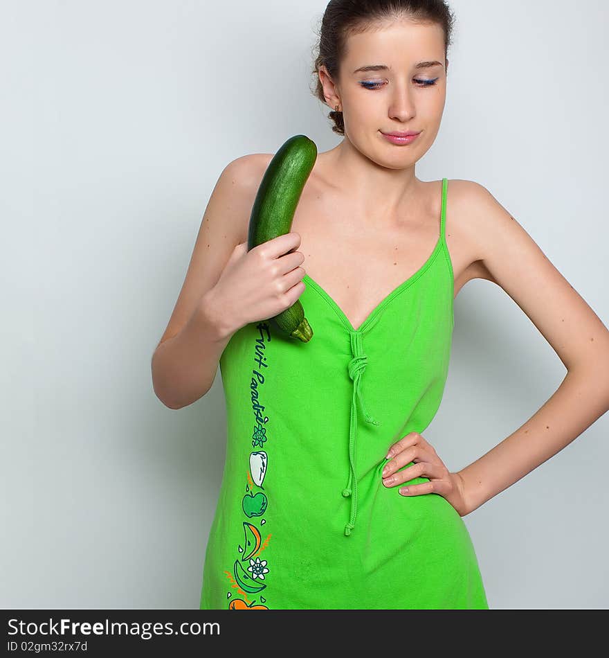 Young girl and squash zucchini