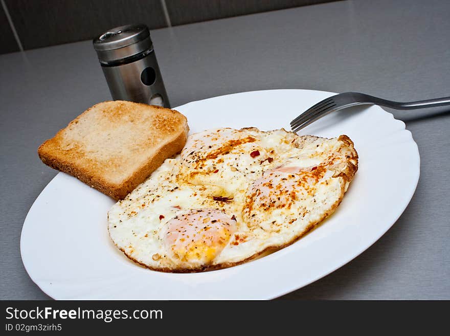 Traditional Indian eggs with curry and hot red pepper. Traditional Indian eggs with curry and hot red pepper