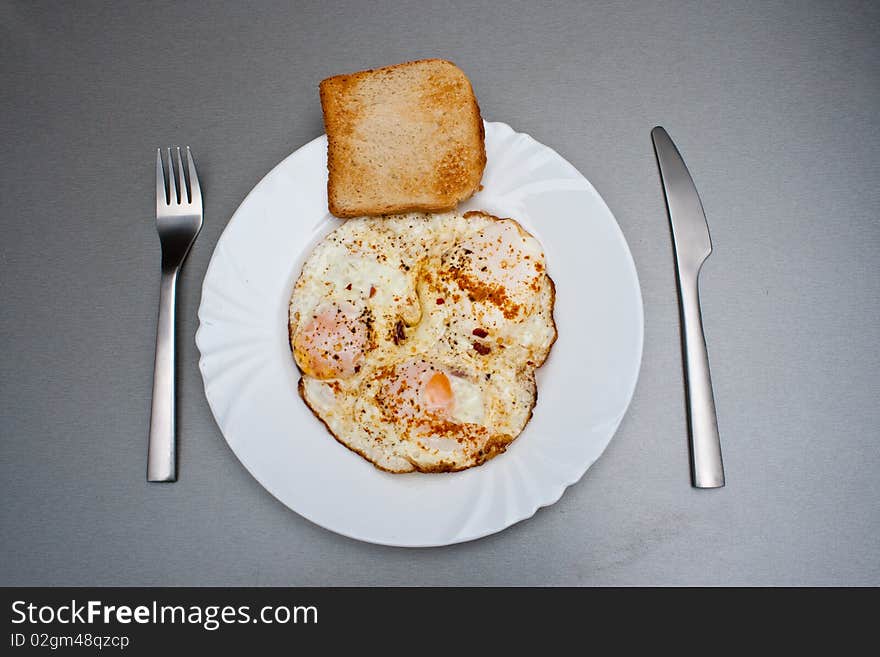 Traditional Indian eggs with curry and hot red pepper. Traditional Indian eggs with curry and hot red pepper