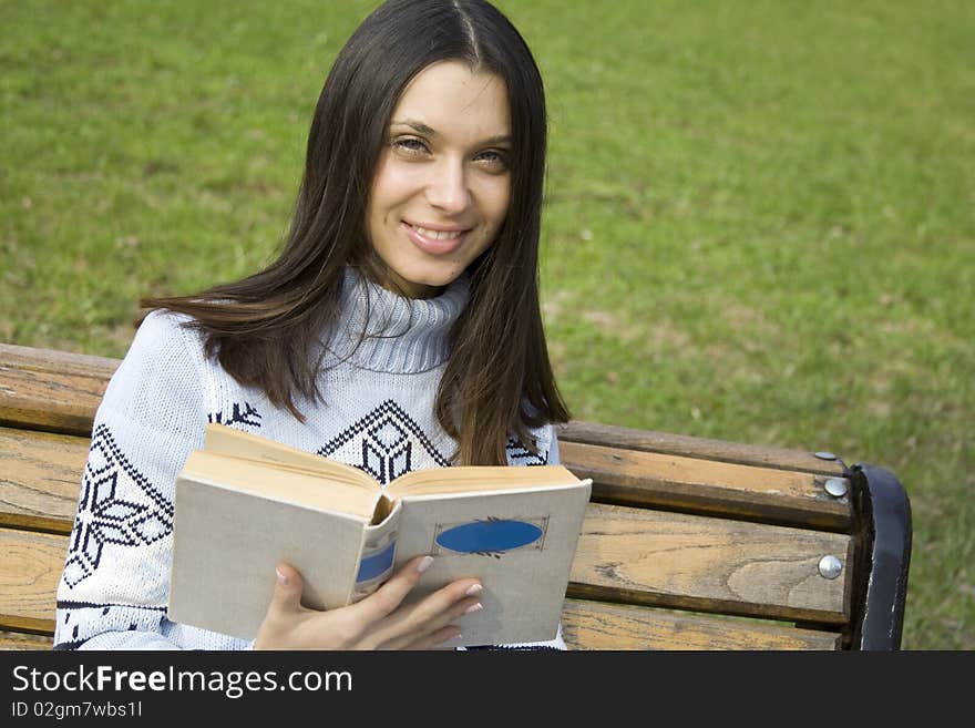 Female In A Park With A Book