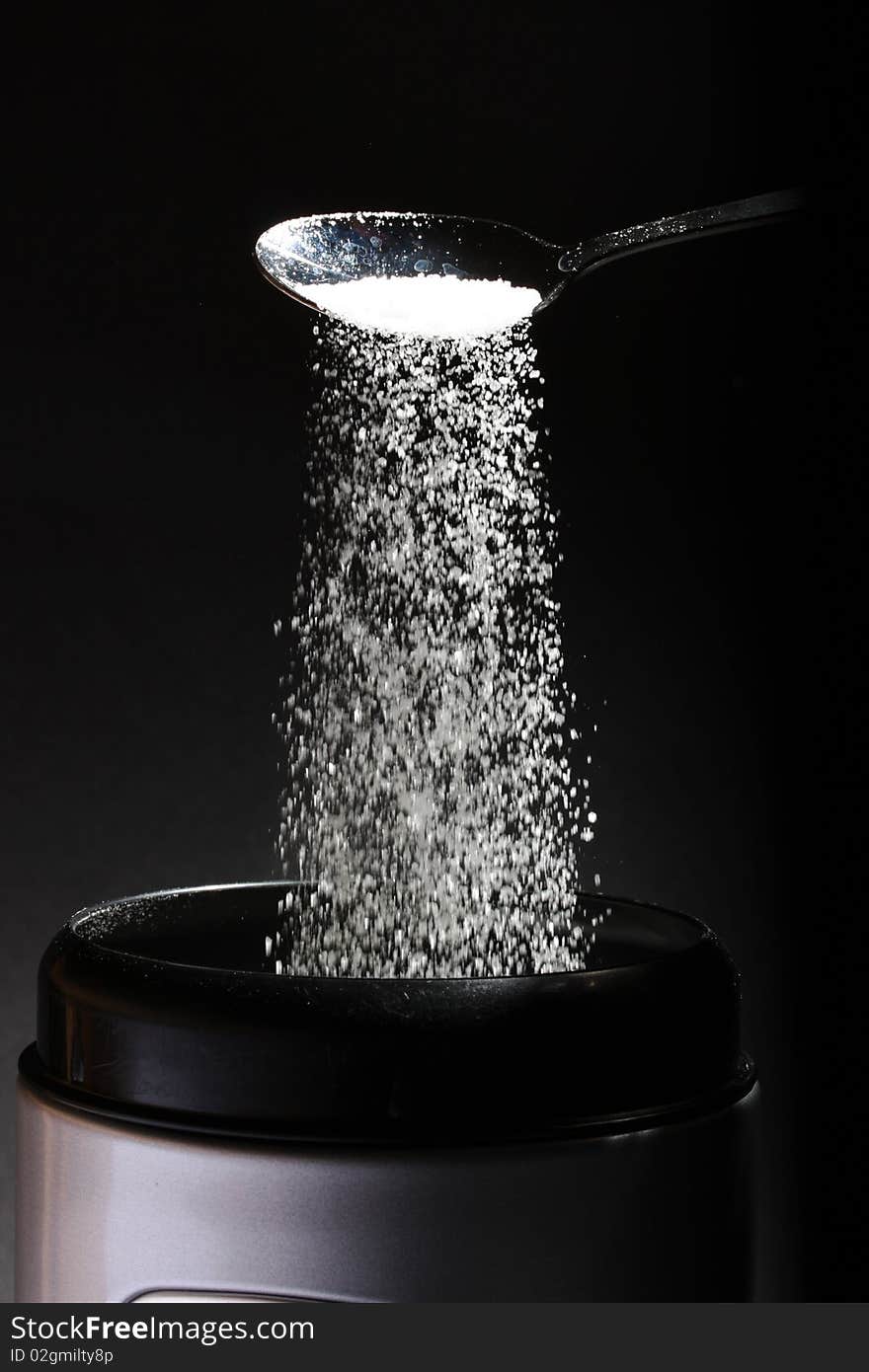 Sugar falling back in the sugar pot. Sugar falling back in the sugar pot.