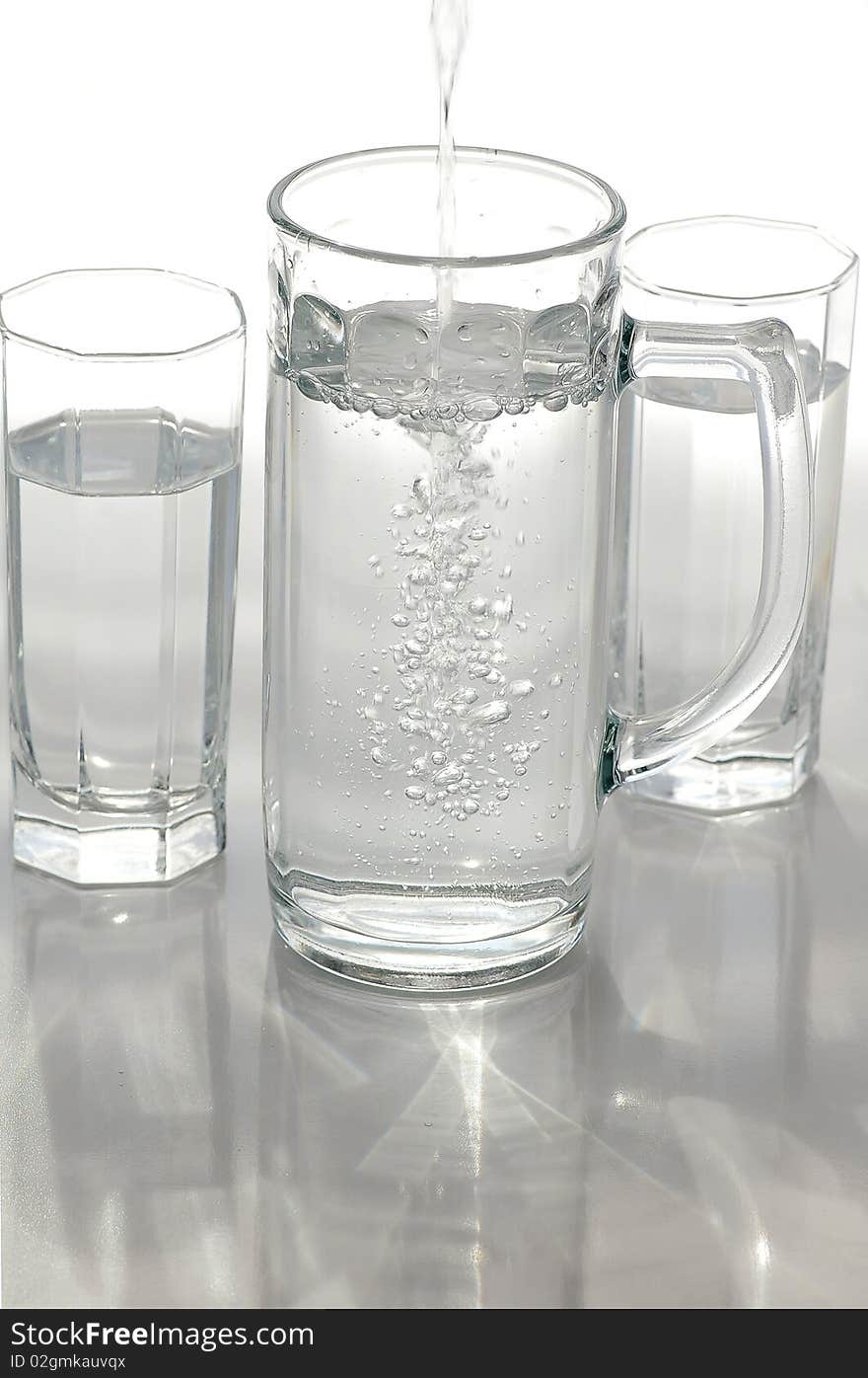 A glass of mineral water on a light background