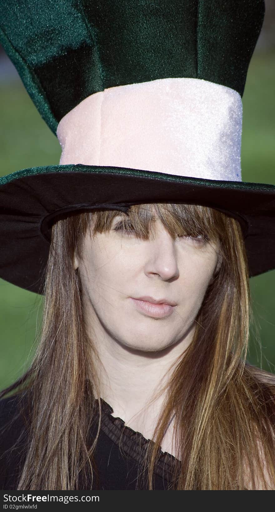 Girl with big hat at a birthday party. Girl with big hat at a birthday party