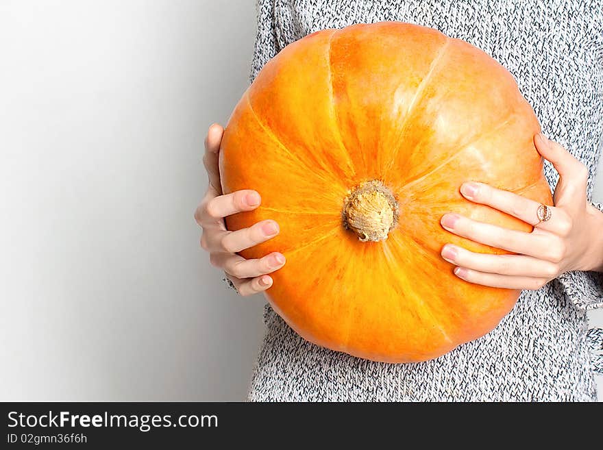 Young Girl And Yellow Pumpkin