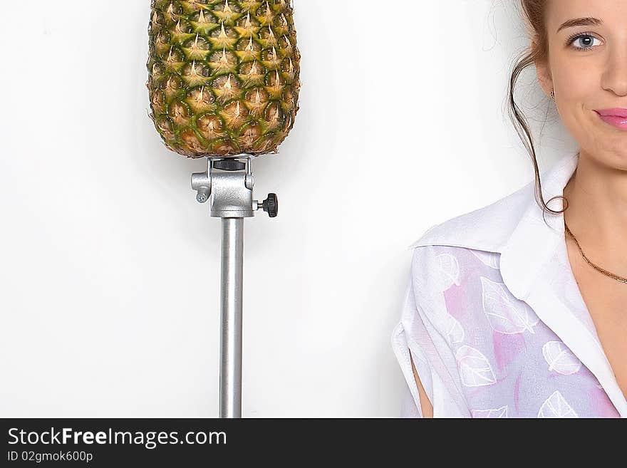 Young Pretty Girl And A Pineapple