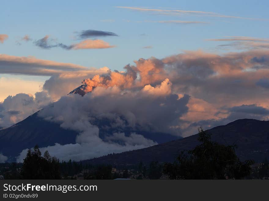 Tungurahua - active volcano with ask cloud at sunset in Ecuador. Tungurahua - active volcano with ask cloud at sunset in Ecuador