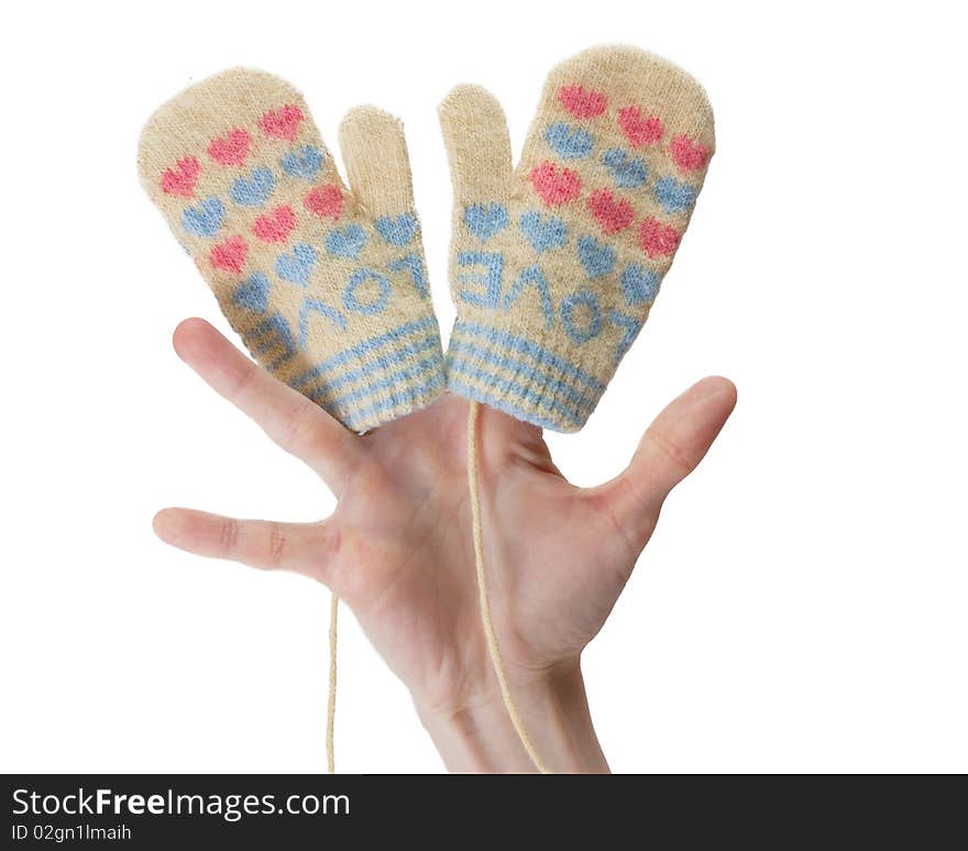 Little baby mittens on a hand isolated on white background. Little baby mittens on a hand isolated on white background