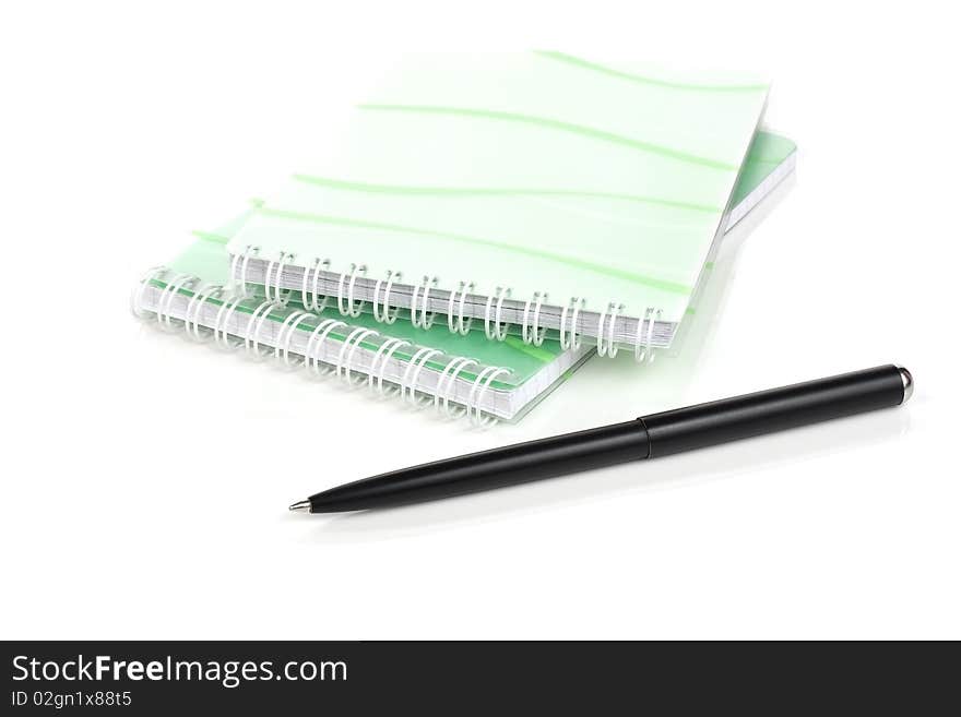 Notebook and pen on a white background