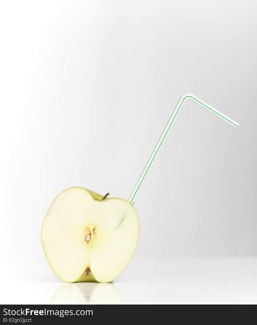 Sliced Apple With Drinking Straw