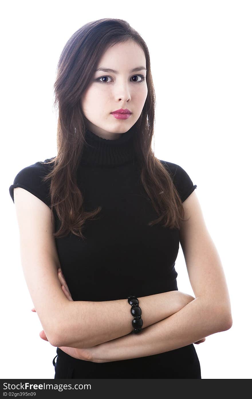 Portrait of a beautiful young woman in black dress isolated on white