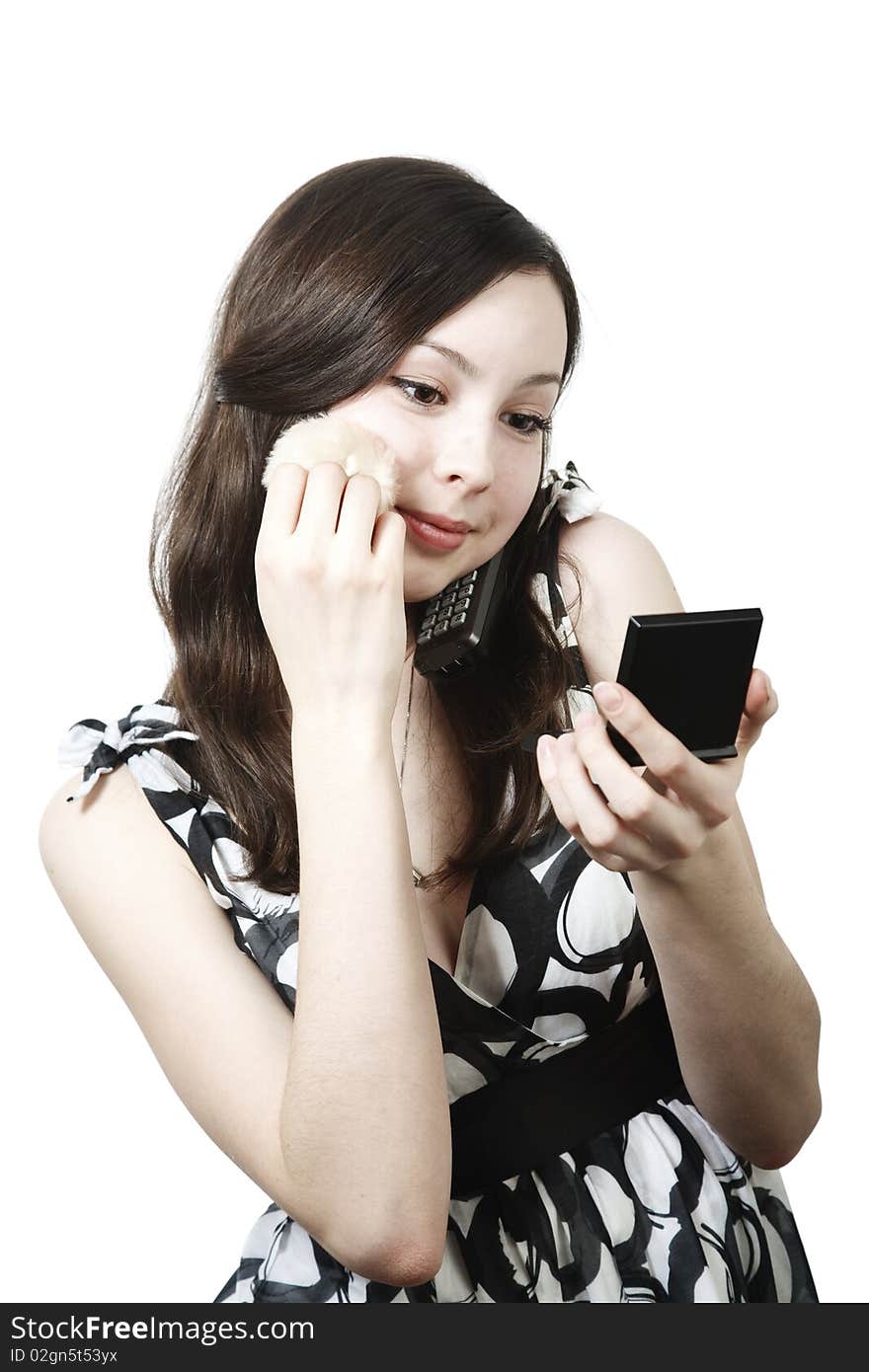 Girl with powder om phone isolated on white