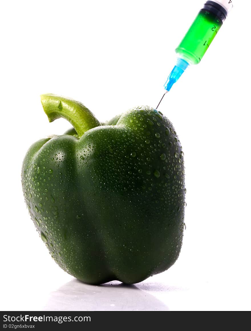 Green Pepper With Syring Injecting Color Into It