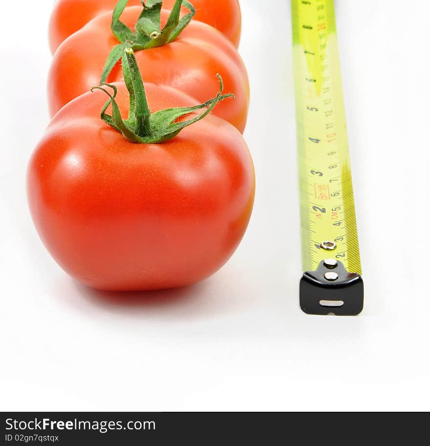 Isolated Fresh Tomatoes And Rule