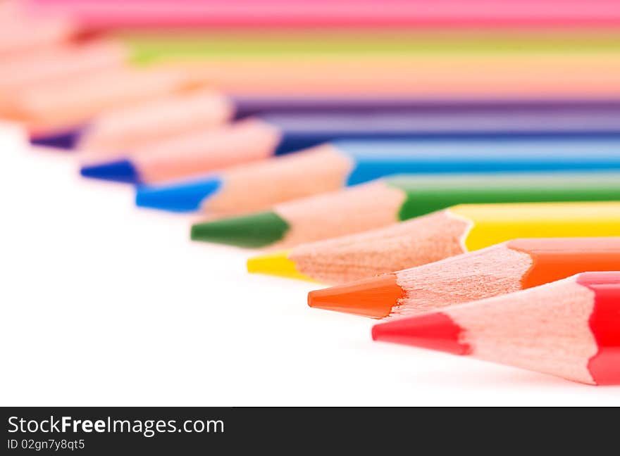 Close-up image of multicolor pencils isolated on white background