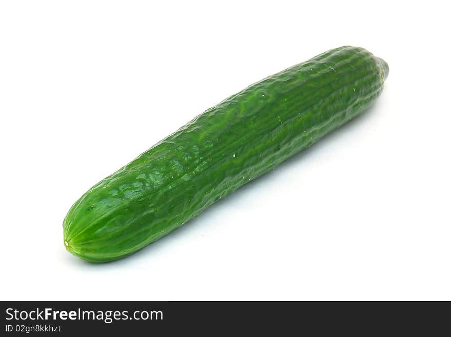 A fresh green cucumber isolated on a white background