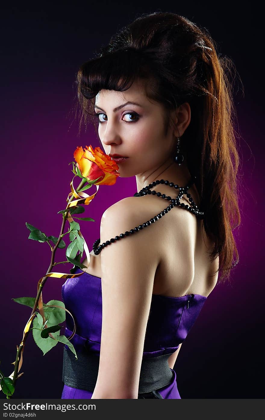 Beautiful lady with a single rose